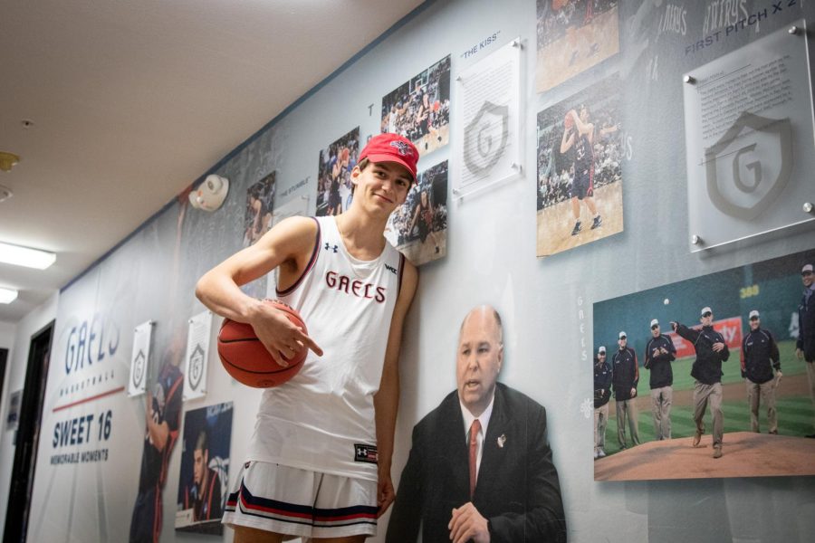 Senior Aidan Mahaney poses with head coach and close friend Randy Bennett in the Saint Mary’s basketball hallway.