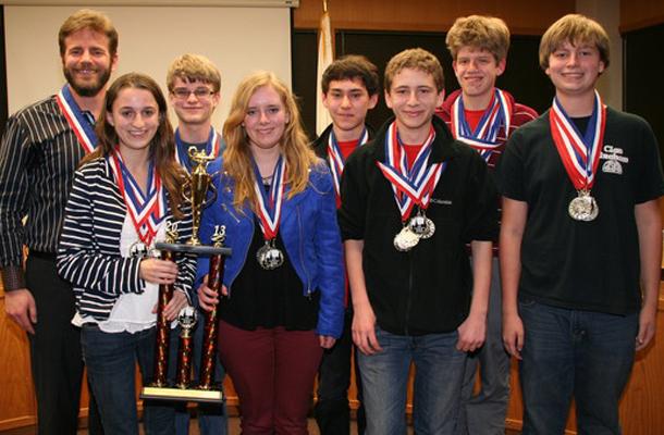 The AcaDeca Red team poses for a photo with their awards.