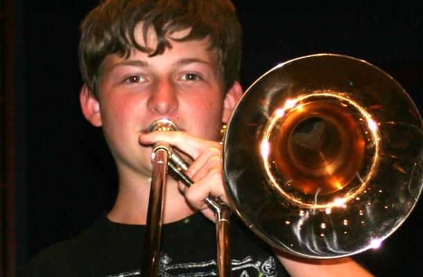 Sophomore Jacob Brickman playing the trombone. 