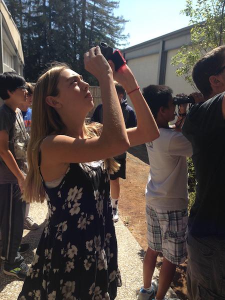 Nicole Edwards (19) watches birds from her binoculars for Ms. Jackmans biology class.