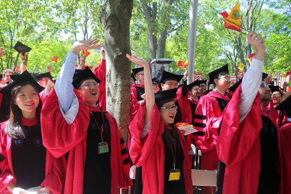 CAMBRIDGE, MA - MAY 29: Students celebrate receiving their degrees at Harvard commencement in the Tercentenary Theatre of Harvard Yard. (Photo by Lane Turner/The Boston Globe via Getty Images)
