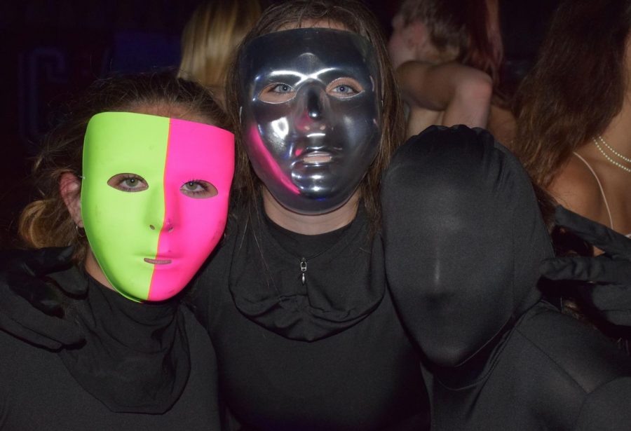 Masked Seniors Flout Tradition with Body Suits