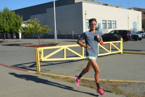 Senior Dylan Gunn jogs after cross country practice. Gunn has committed to UC Davis and plans to continue his athletics career there.