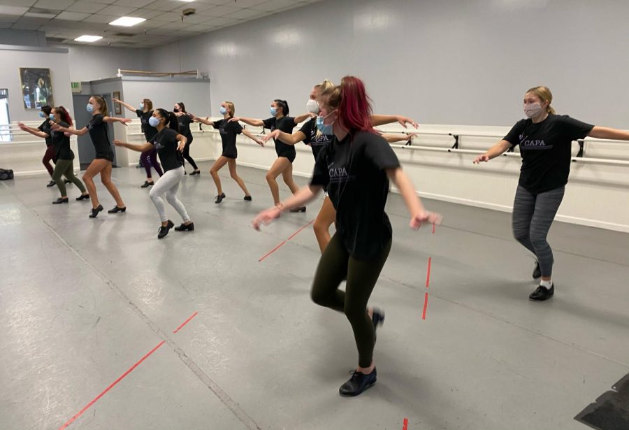 Students at the California Academy of Performing Arts (CAPA) tap dance while wearing masks. Dance studios have been making a return to regular scheduling by ensuring COVID-19 safety guidelines for students in class. 
Photography by Caroline Fitzpatrick