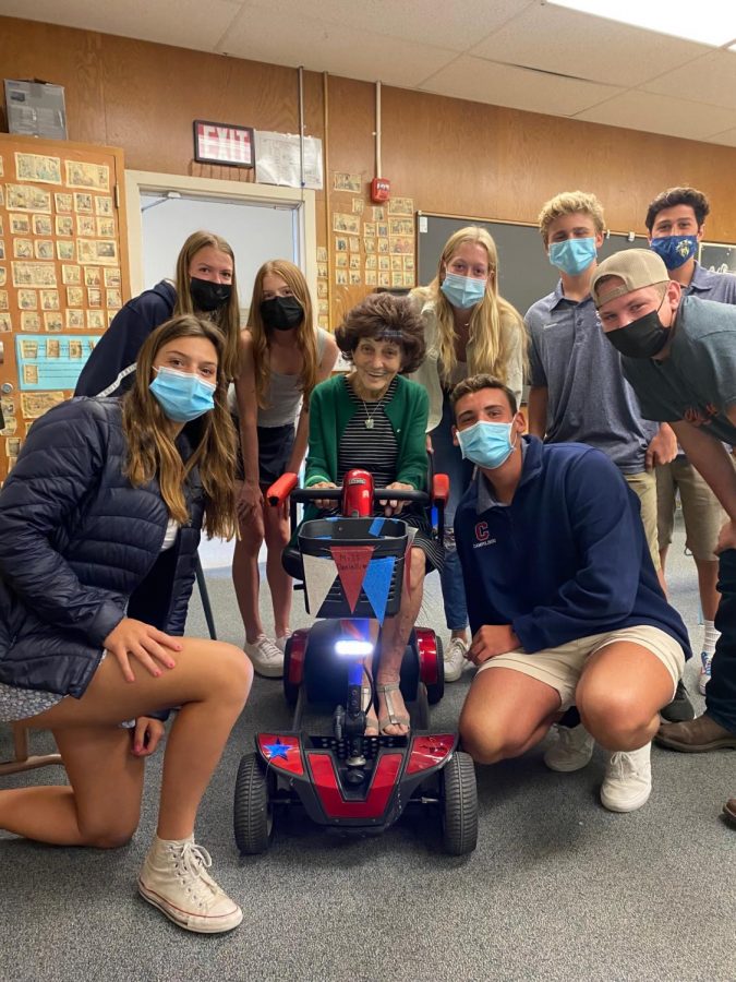 Leadership students pose with Ms. Danielli and her newly gifted scooter.