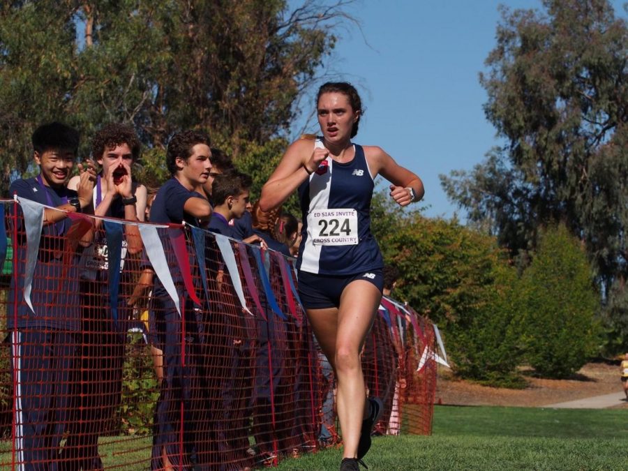 Sophomore Daisy Penny pushes through the final stretch to earn a spot in top 5 Frosh Soph girls.