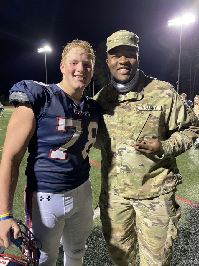 Elijah Klock and former Campo student Matai Bell pose together during the Homecoming game.