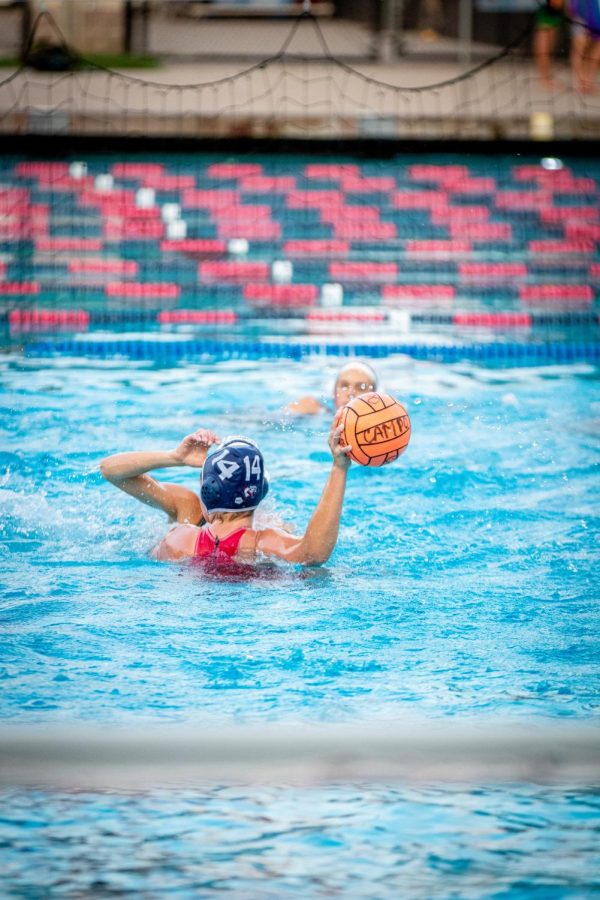 Junior Kaia Levenfeld (14) throws the ball after the defensive stop.