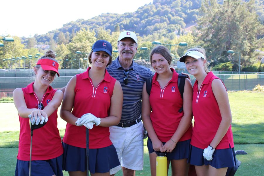 Coach and team of Campolindo golf smile right before the golf tournament.