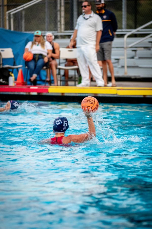 Junior Ava Jacuzzi (6) 
pushes the ball forward after the defensive play.
