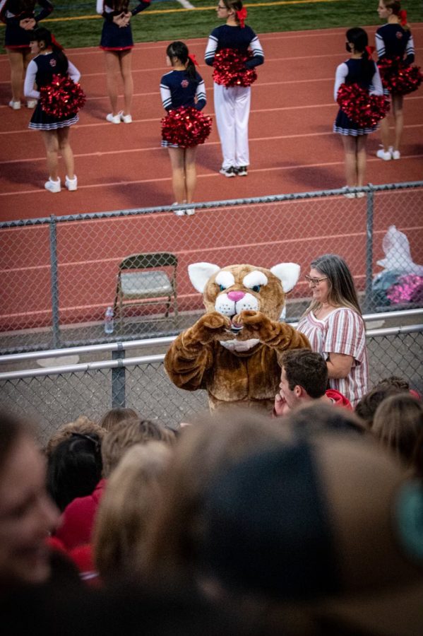 The Campolindo Cougar sending hearts and spreading spirit at a football game.