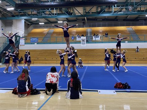 The competitive cheer team performing angels during their regional competition.