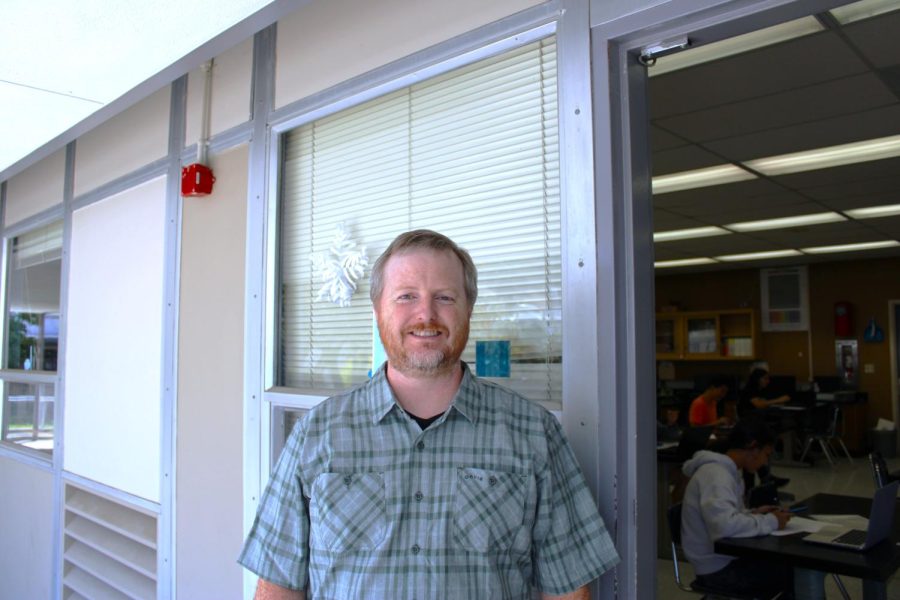 David+Talcott+stands+outside+the+AP+Physics+classroom.