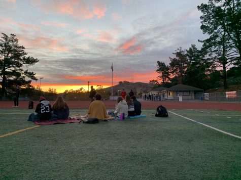 Seniors watch the sunrise on the Campo field which signifies the beginning and end of their last year at Campolindo.
