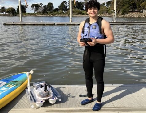 Freshman Lucas Katz showcasing his Unmanned Mobile Surface Level by the San Francisco Bay Area