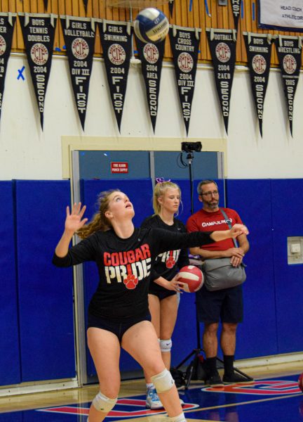 Junior Fiona Markey prepares to serve the ball.