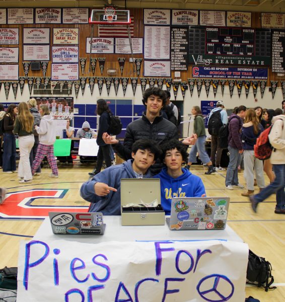 Juniors Jack Braun, Jonny Wang, and Owen Ludwig selling Pie for Peace.