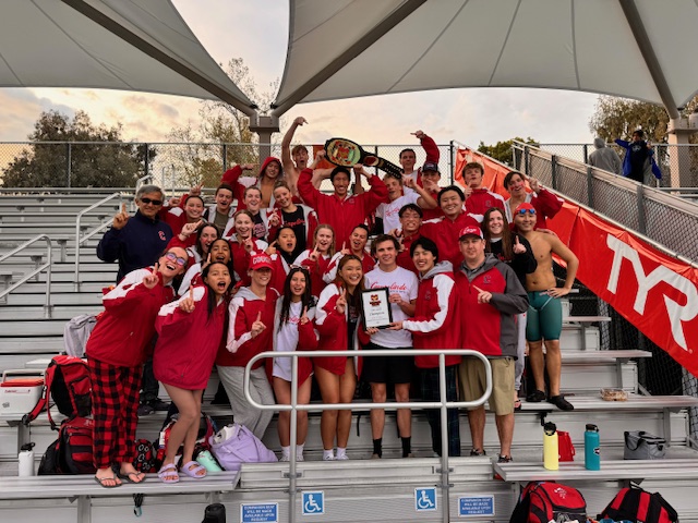 Campo Swim poses with Mission Viejo belt after winning overall on Saturday March 16.