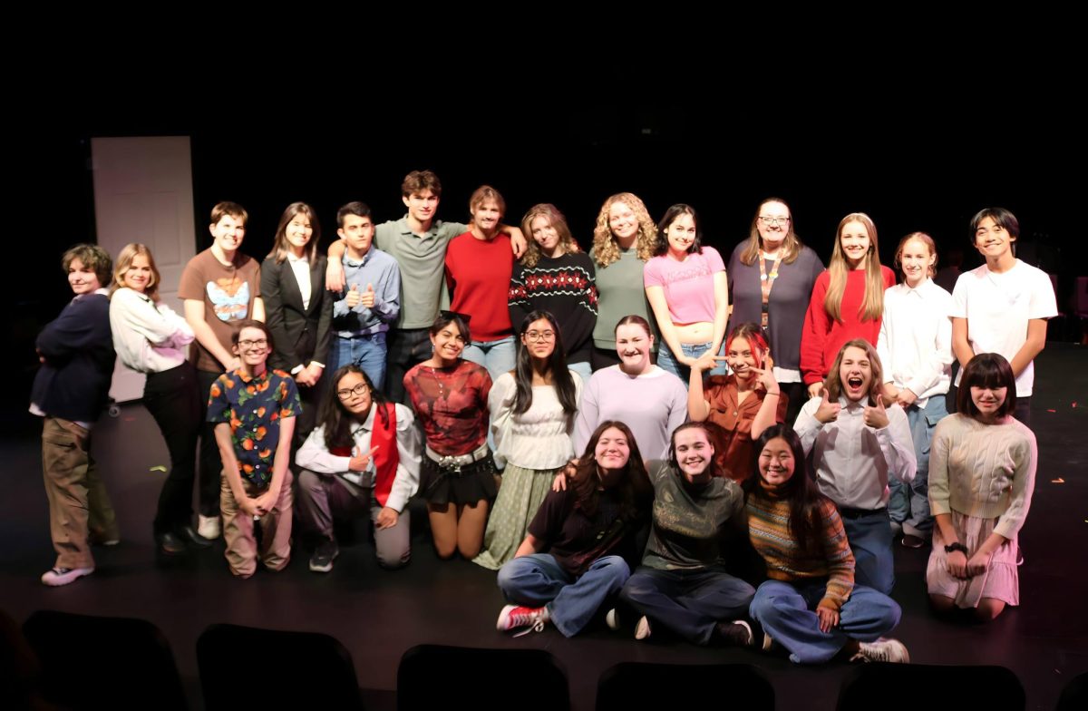 CNL cast poses for photo during rehearsal.