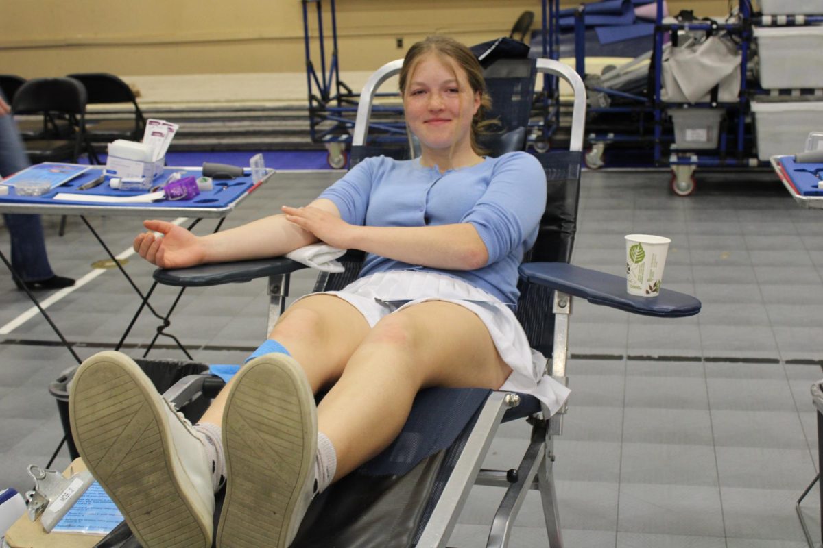 Lindsay Foster smiles during her blood draw.  