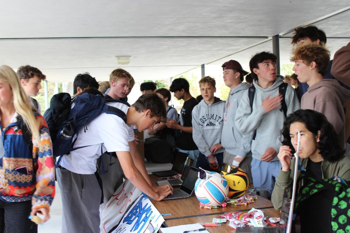 Students sign up for new and returning clubs at annual Club Day event during lunch.