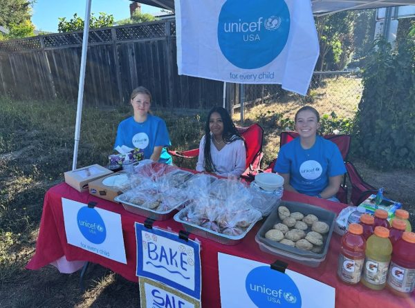 Members of UNICEF Club sell food items at bake sale.