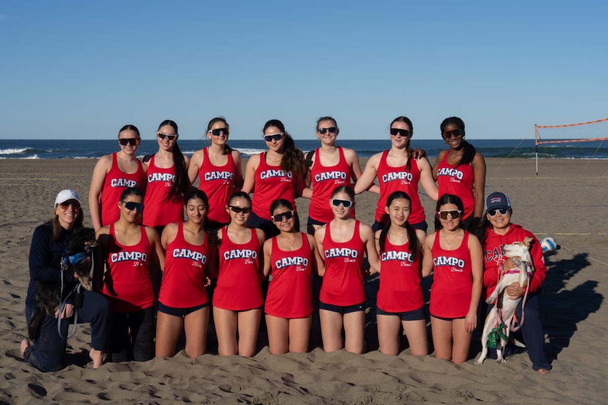 Girls beach volleyball team is all smiles after being the 1st place school at their first tournament. 