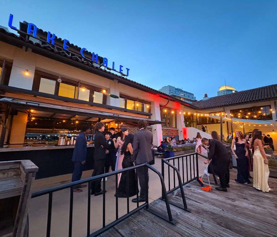 The Lake Chalet offers a soft glow for the partying juniors at Prom as the air becomes cool and the students comfortably chat.