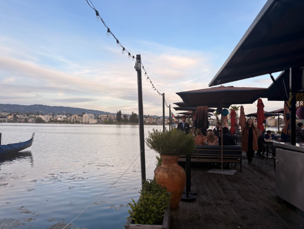 A restaurant on a dock is open for early comers of prom to enjoy the cool breeze and some snacks.